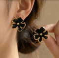 Black Flower Stud Earrings with Gold Trim